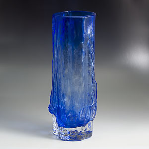 blue glass vase with a clear bottom and a rough finish, possibly finnish