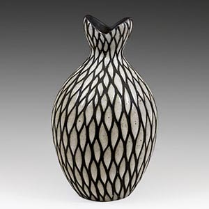 Black and white  vase  with sgraffito decoration ofdark lines cut into the thick white overglaze