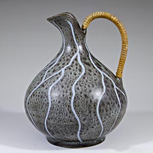 unknown maker grey pitcher with white streaks and a raffia handle