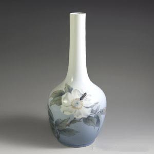royal copenhagen art nouveau vase decorated with a white flower with a bee hovering over it number 1659 43 B
