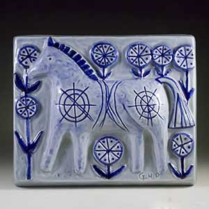 soholf relief in blue and white by gerd hjort petersen featuring a horse number 3520
