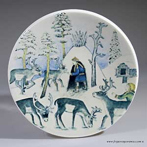 From Arabia of Finland, a small plate depicting a reindeer keeper in winter from 1982
